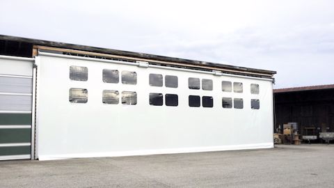 Une porte de hangar souple pour les grandes largeurs Une porte de hangar souple pour les grandes largeurs
