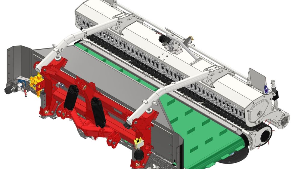 Le R3 Compact s'équipe du pick-up de génération 2.0 avec un béquet pour projeter le fourrage ramassé sur le fond du tapis.